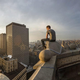 Pete Parker sitting on top of a building.